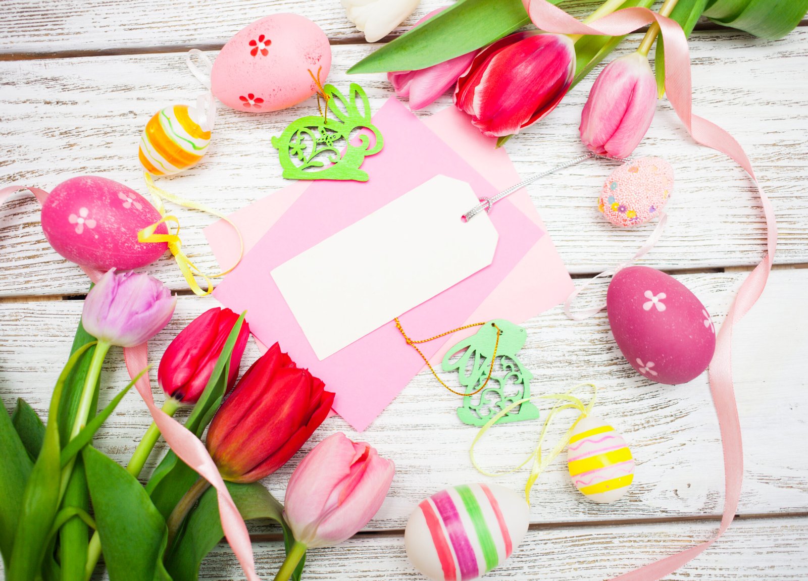 Easter,Background,With,Colorful,Eggs,,Tulips,And,Greeting,Card,Over